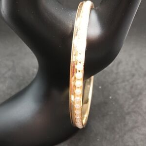 Gold and White Bangle Bracelet with Elegant Design